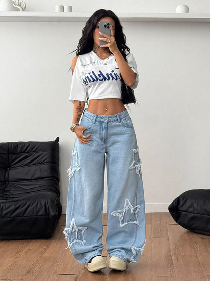 Light blue distressed star patch wide-leg jeans by Trendsi, featuring a relaxed fit and fashionable torn details.