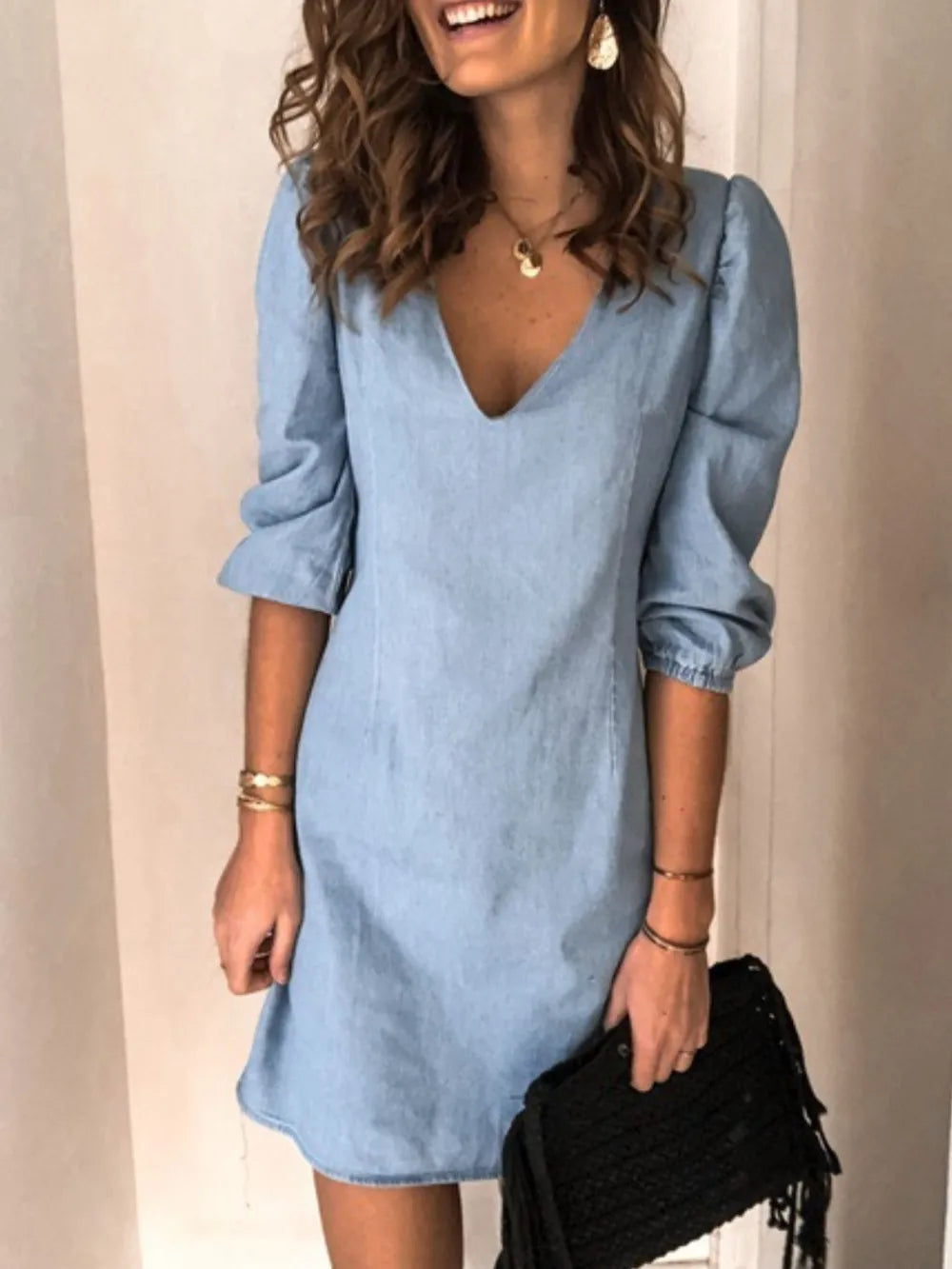 Light blue full-size V-neck half-sleeve dress by Trendsi, displayed on a hanger against a white background.