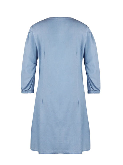 Light blue full-size V-neck half sleeve dress from Trendsi, displayed on a hanger, showcasing its casual and comfortable style.
