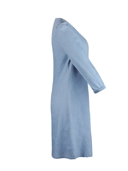 Light blue full-size V-neck half sleeve dress by Trendsi, shown hanging on a hanger with a flowing fabric design.