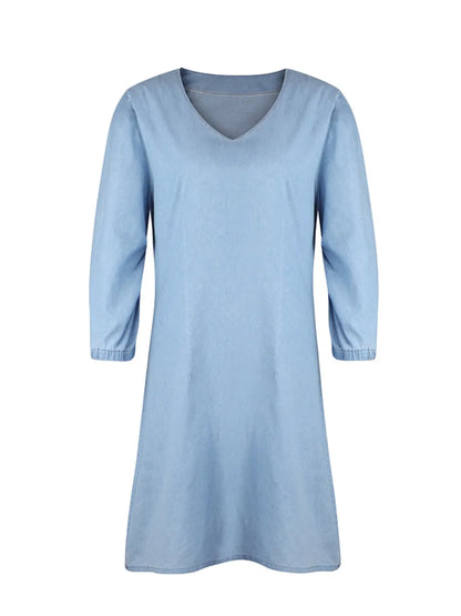 Light blue full-size V-neck half-sleeve dress by Trendsi, shown on a mannequin, featuring a relaxed fit and soft fabric.
