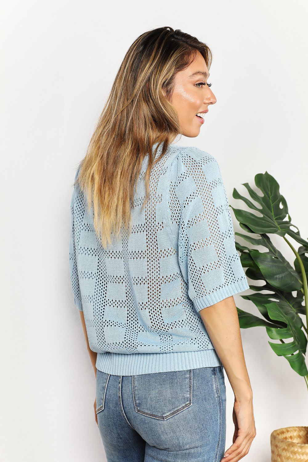 Light-blue Mandy ribbed trim round neck knit top by Trendsi, showcasing its fitted design and soft, textured fabric.