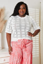 Light blue Mandy ribbed trim round neck knit top by Trendsi, close-up of soft, fitted fabric with ribbed neckline detail.