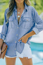 Light blue denim long sleeve top with a collar and front pockets, featuring a trendy collared neck design.