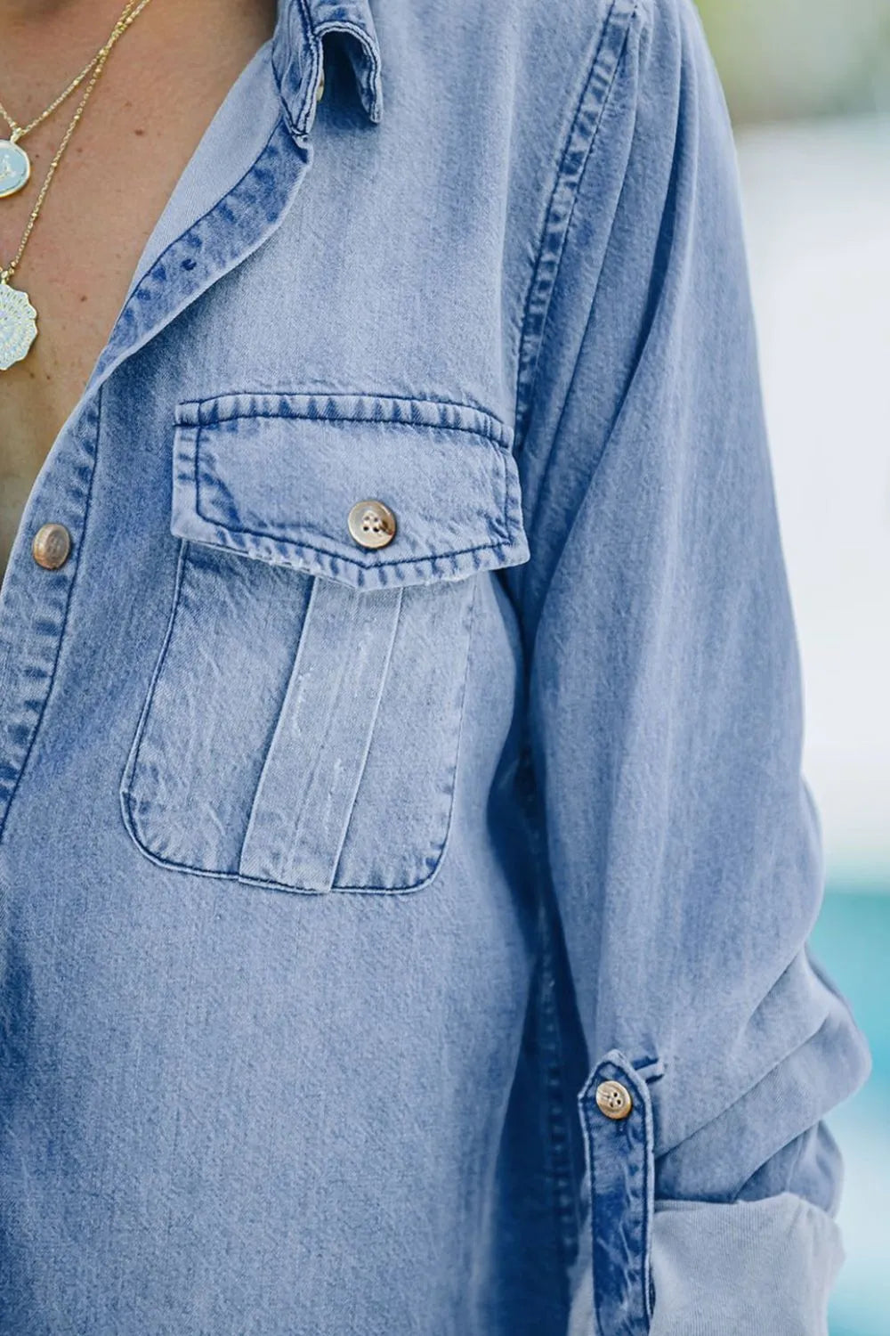 Light blue denim top with pocketed collar and long sleeves, Trendsi long sleeve denim shirt for casual wear.
