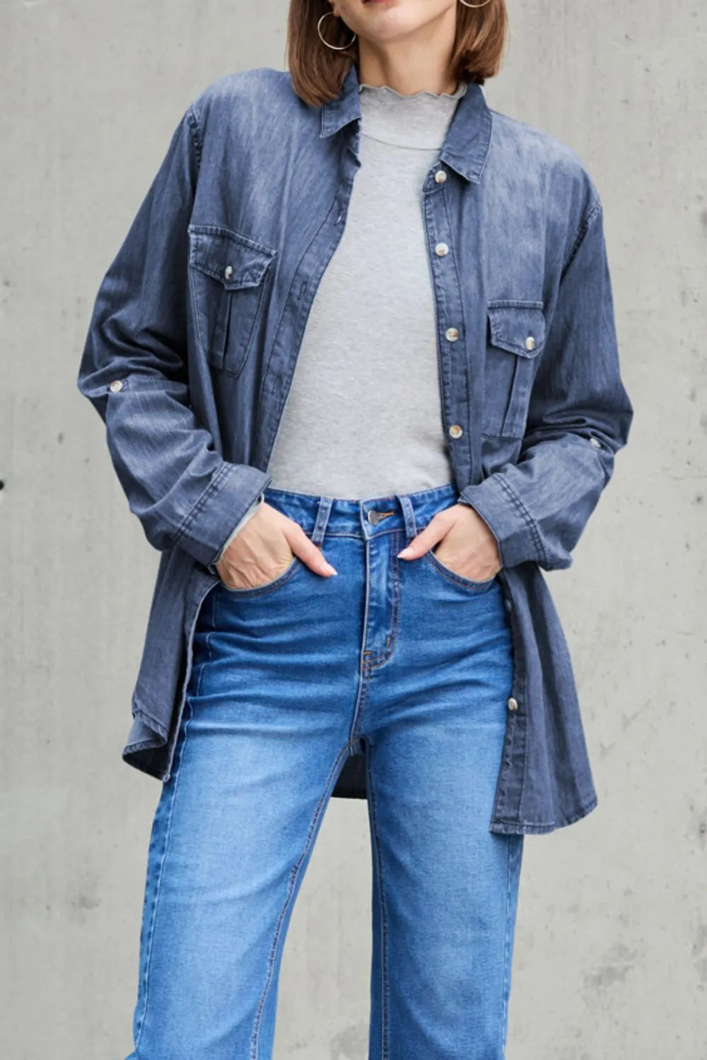 Light blue denim long sleeve top with collar and pockets, by Trendsi, featuring a casual, stylish design.