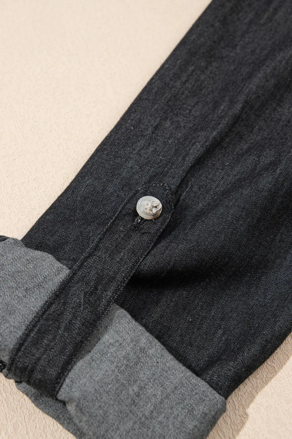 Light blue denim long sleeve top with pockets and collared neck, by Trendsi, featuring a casual, stylish design.