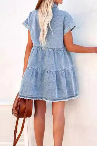 Light blue raw hem button-down denim mini dress by Trendsi, featuring a classic collar and fitted waist, casual and stylish.