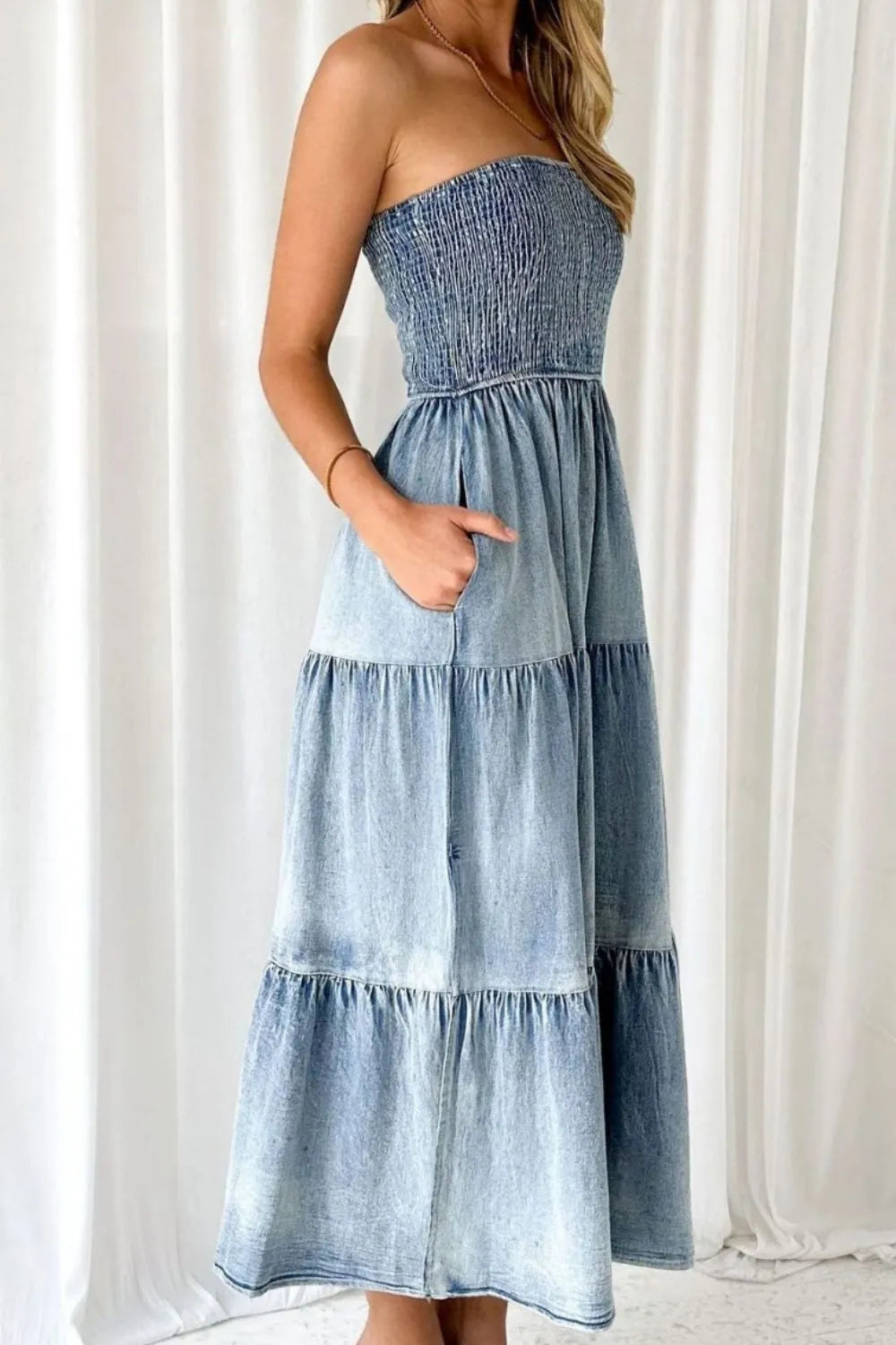 Light blue smocked tube denim dress with slit and tiered design, featuring trendy casual style from Trendsi.