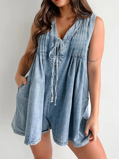 Light blue tied romper with pockets from Trendsi, featuring a casual sleeveless design and front pockets for a relaxed look.
