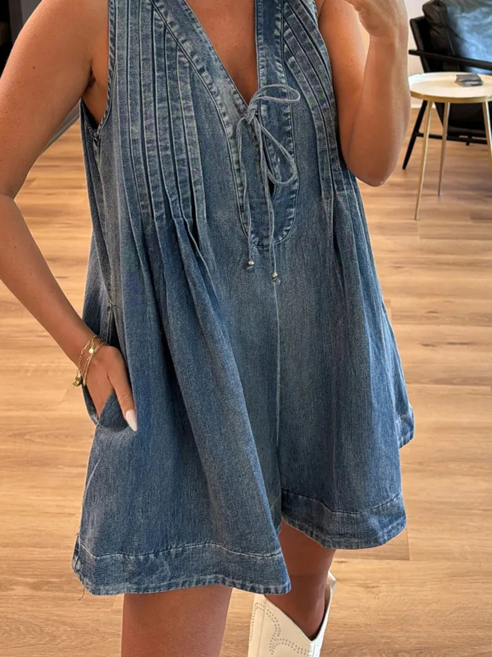 Light-blue tied romper with pockets from Trendsi, featuring a relaxed fit and casual style, perfect for warm weather.