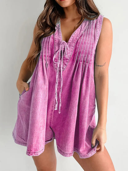 Light blue tied romper with pockets from Trendsi, featuring a sleeveless design and casual fit.