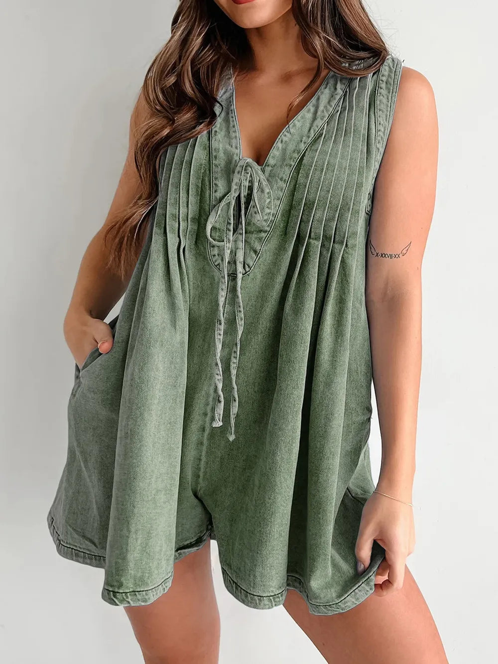 Light-blue tied romper with pockets from Trendsi, featuring a casual, stylish design and comfortable fit.
