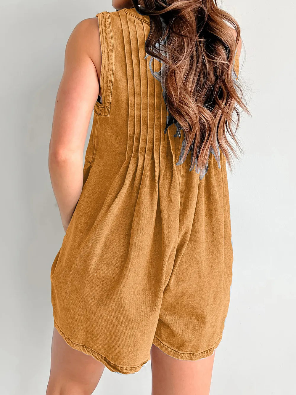 Light-blue tied romper with pockets from Trendsi, featuring a stylish design and casual fit, perfect for warm weather.