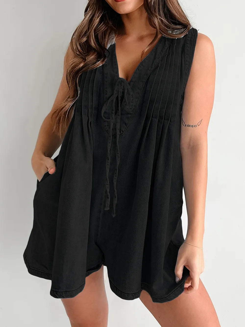 Light blue tied romper with pockets by Trendsi, featuring a casual fit and stylish design perfect for warm weather.