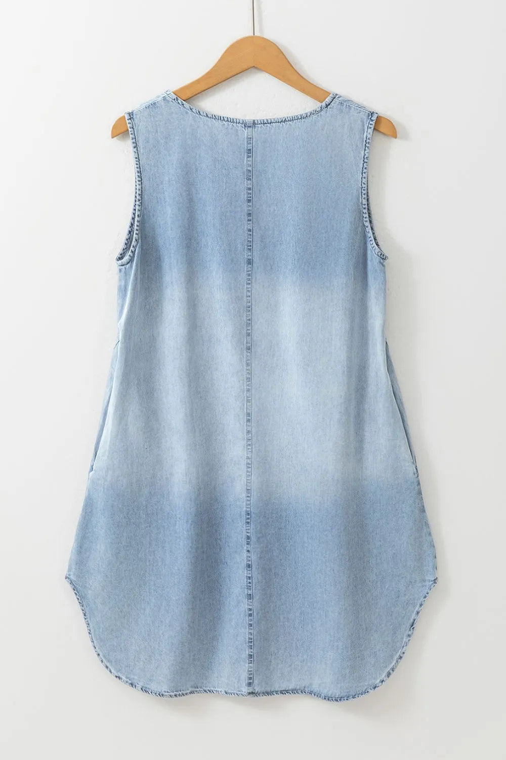 Light blue sleeveless mini denim dress with notched neckline from Trendsi, featuring a casual and stylish fit.