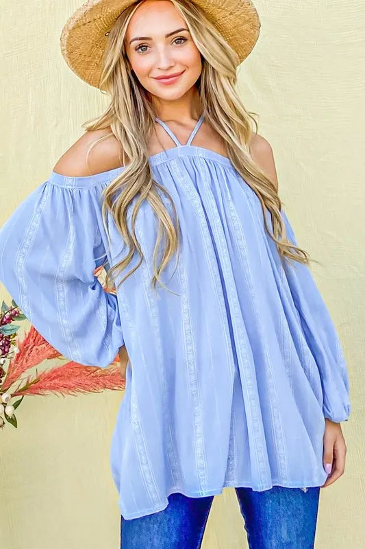Light blue striped cold shoulder halter neck top by Trendsi, featuring a stylish printed design and sleeveless cut.