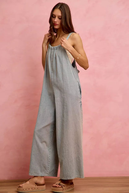 Light blue wide-leg lightweight denim overalls by Trendsi, featuring adjustable straps and front pockets.