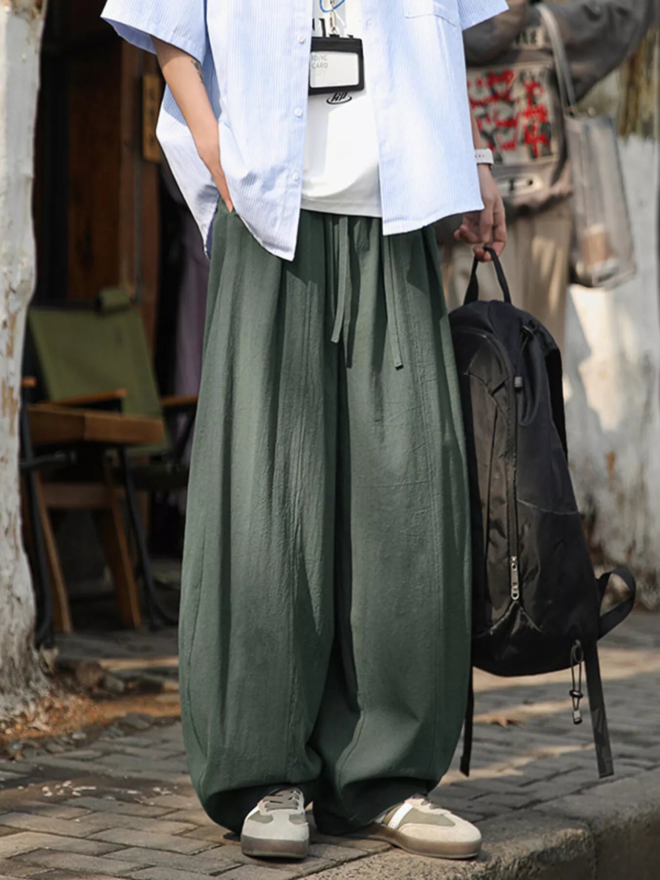 Light gray men's plus size loose fit wide leg pants by Trendsi, showing relaxed fit and comfortable waistband.
