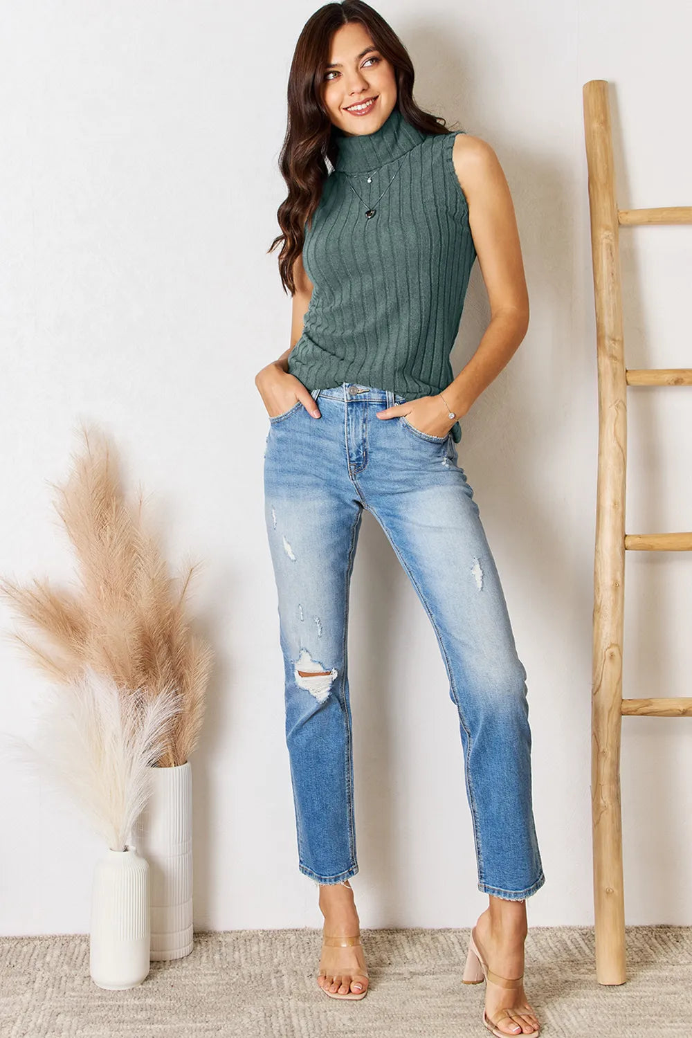Light gray Trendsi Basic Bae full-size ribbed turtleneck tank top displayed on a hanger, showcasing its fitted design and ribbed texture.