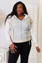 Light gray Trendsi Double Take color block hoodie with exposed seams and drawstring hood, casual and stylish for everyday wear.