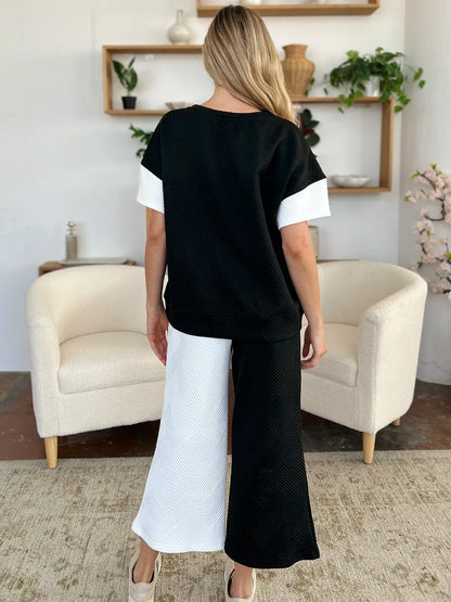 Light gray Trendsi Double Take full-size texture contrast T-shirt and wide-leg pants set, showcasing stylish casual outfit.