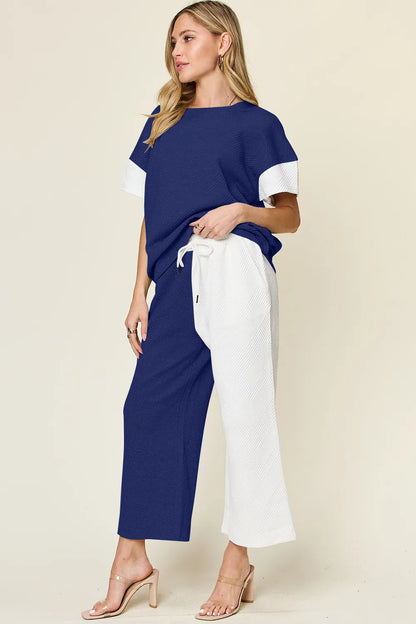 Light gray double take T-shirt and wide-leg pants set from Trendsi, featuring textured contrast fabric.