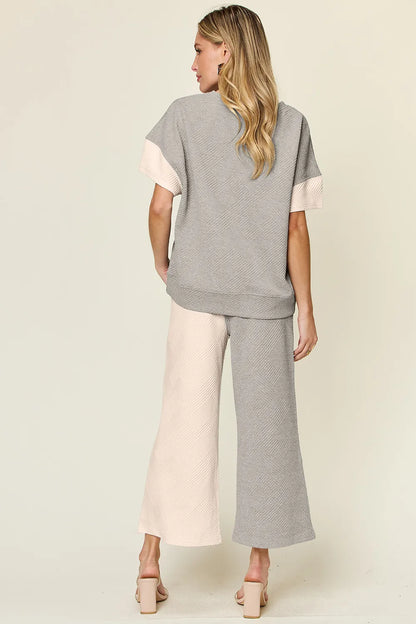 Light gray Trendsi double take full size texture contrast T-shirt and wide-leg pants set, showcasing stylish casual wear.