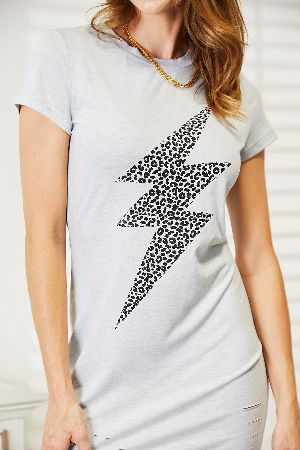 Light gray Double Take Leopard Lightning Graphic Tee Dress by Trendsi featuring a bold leopard and lightning print.