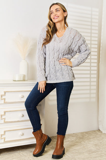 Light gray woven cable-knit hooded sweater from Trendsi with a cozy, textured design and a relaxed fit.