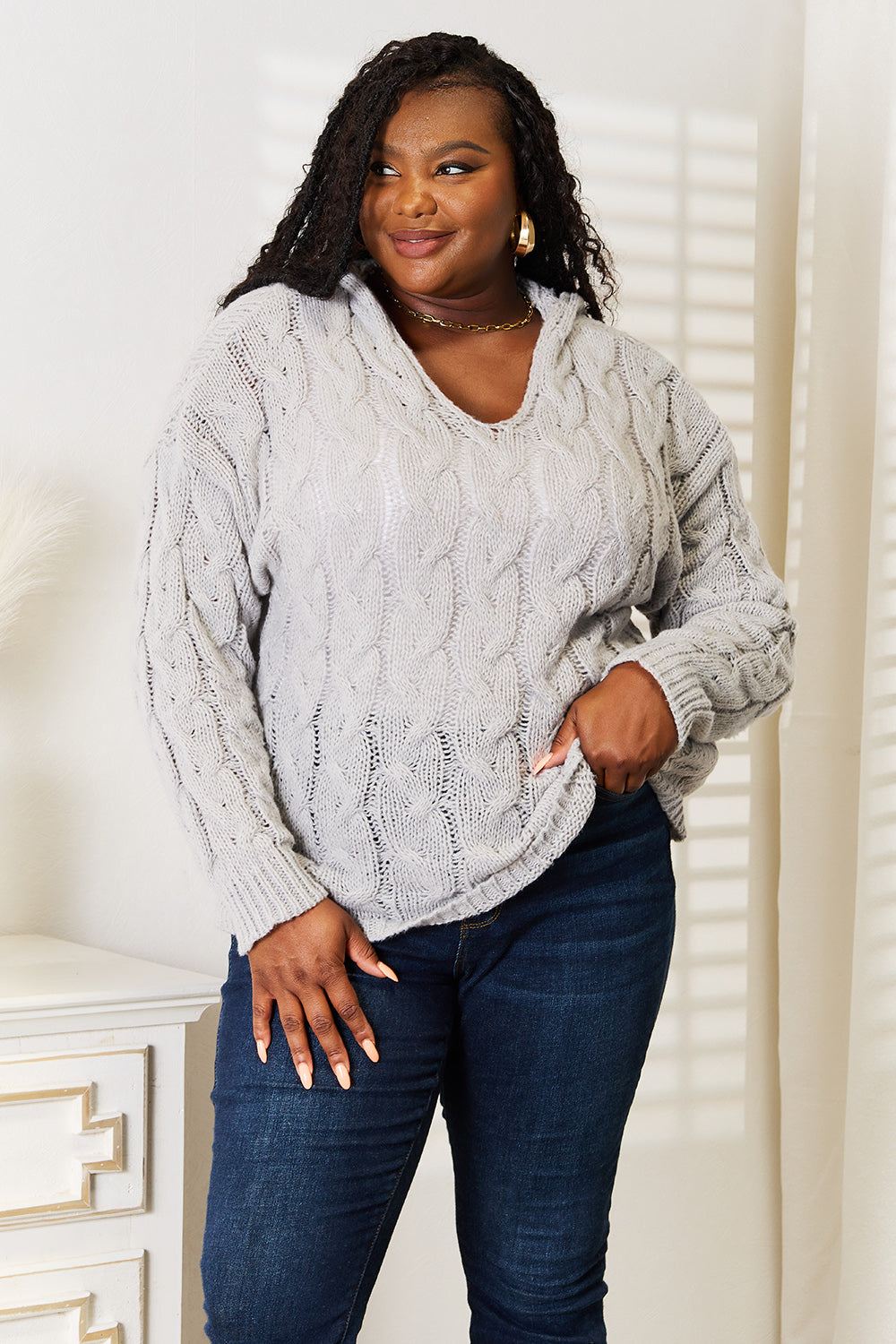 Light gray woven cable-knit hooded sweater from Trendsi, featuring a cozy, textured design and a comfortable fit.