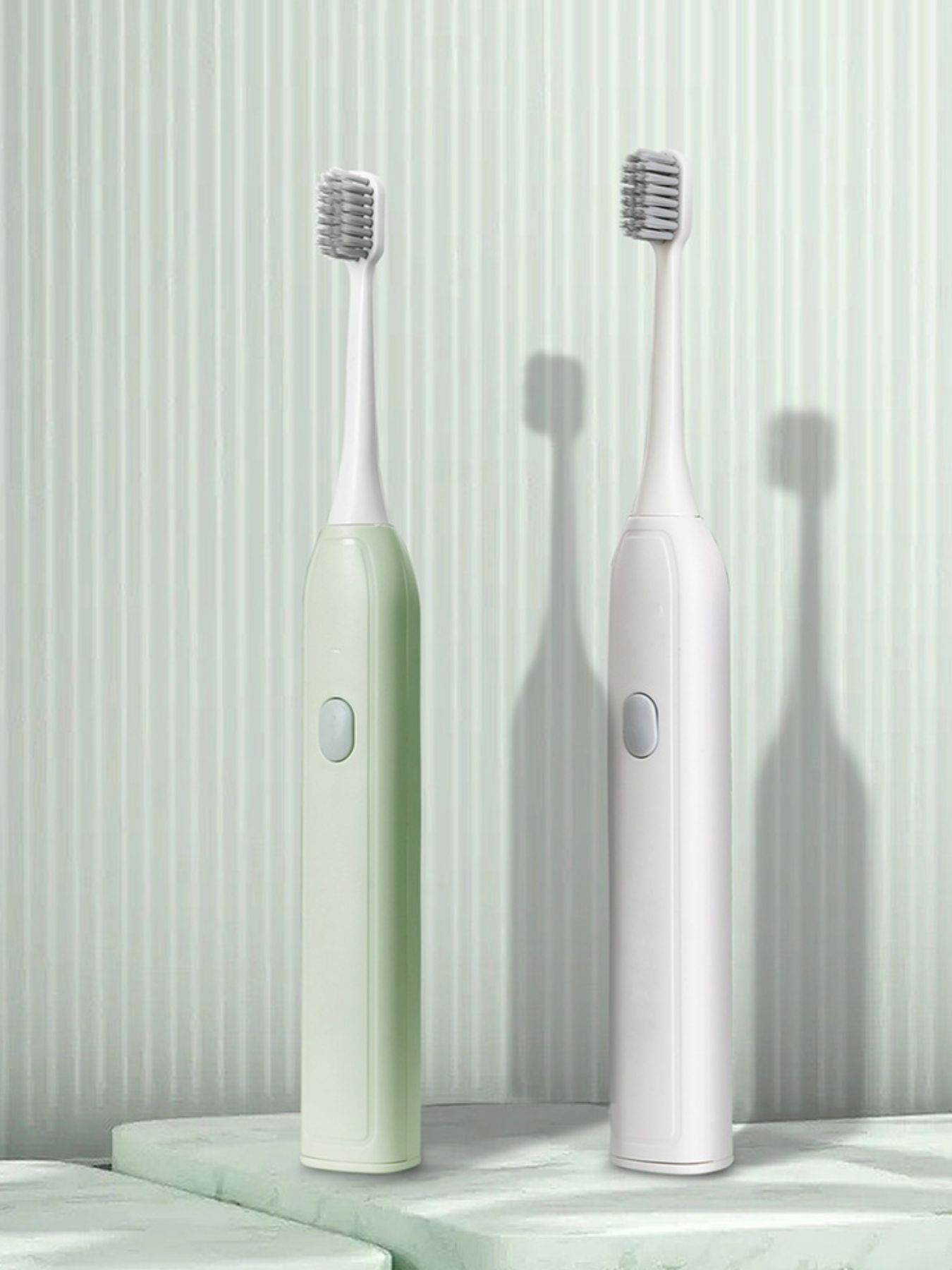 Light green portable electric toothbrush from Trendsi with a compact design and one-size fits all brush head.