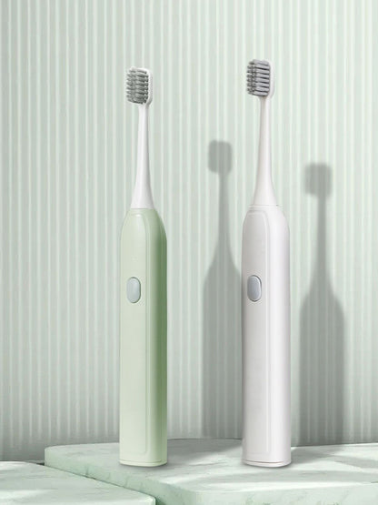Light green portable electric toothbrush from Trendsi with a compact design and one-size fits all brush head.
