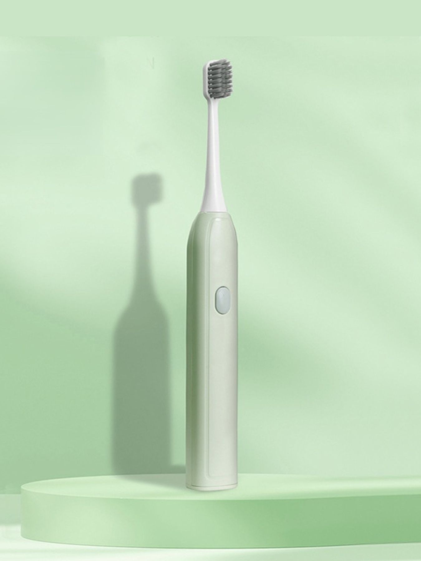 Light green portable electric toothbrush by Trendsi with compact design and rechargeable battery for on-the-go oral care.