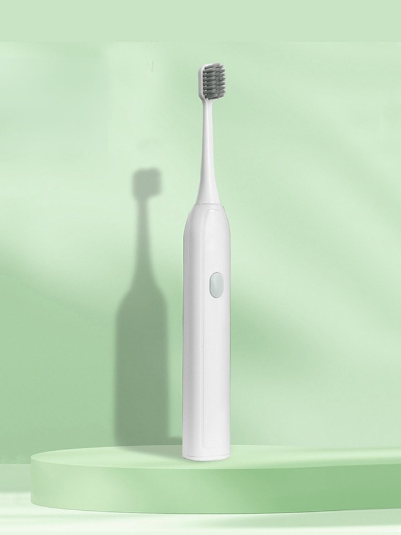 Light green portable electric toothbrush by Trendsi with compact design and removable brush head for travel and everyday use.