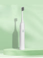 Light green portable electric toothbrush by Trendsi with compact design and removable brush head for travel and everyday use.