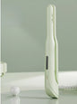 Light green Trendsi cordless rechargeable hair straightener with sleek design and ceramic plates for smooth styling.