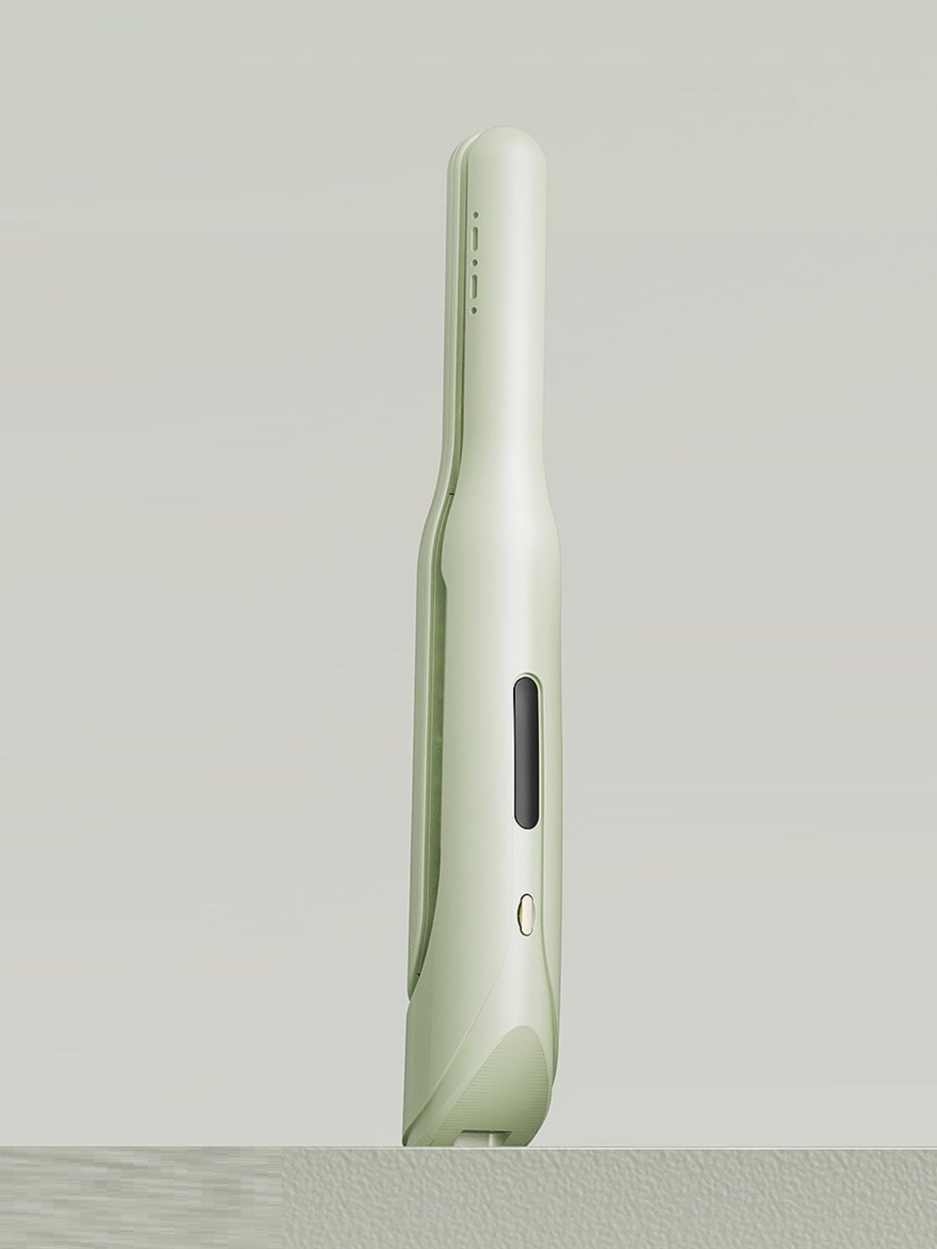 Light green Trendsi cordless rechargeable hair straightener with a sleek design for easy styling.