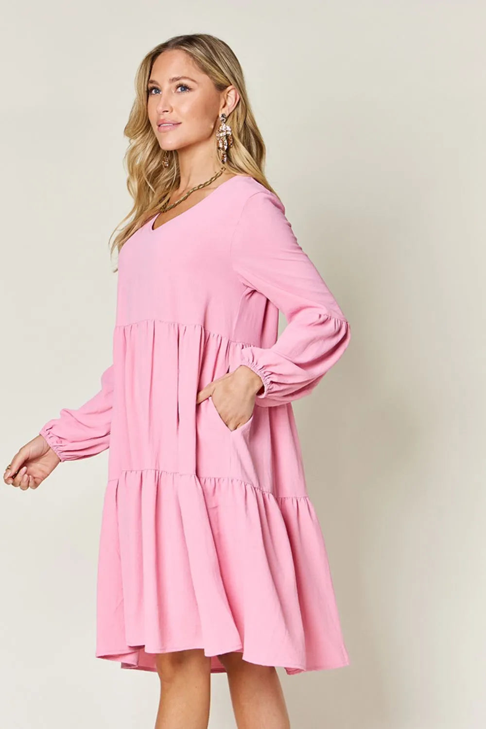 Light green Trendsi Double Take full-size V-neck balloon sleeve tiered dress with pockets, stylish and comfortable for everyday wear.