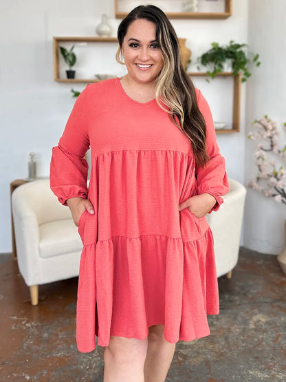 Light green Trendsi Double Take full-size V-neck balloon sleeve tiered dress with pockets, perfect for casual or dressy occasions.