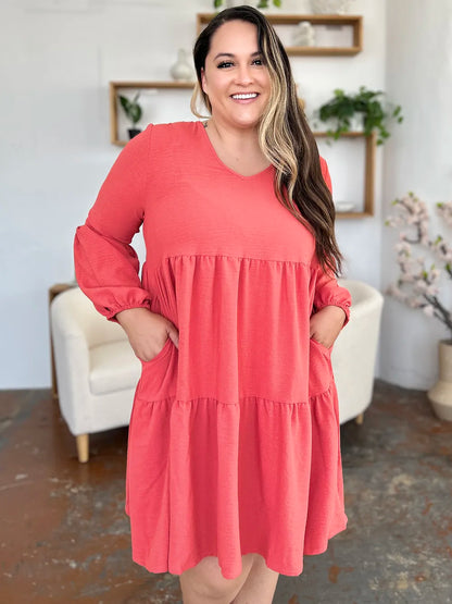 Light green Trendsi Double Take V-neck balloon sleeve tiered dress with pockets, full size, stylish and comfortable for casual wear.