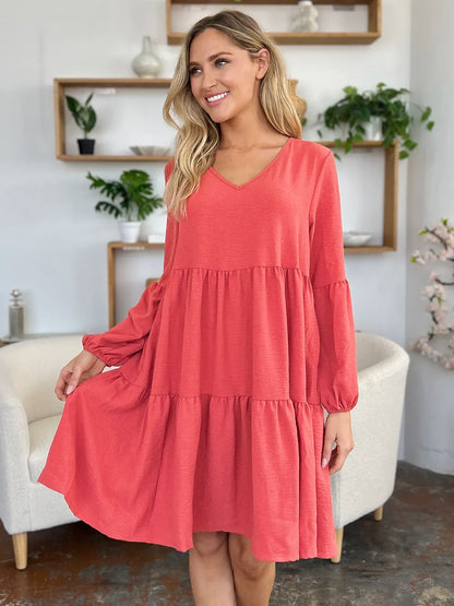 Light green Trendsi Double Take full-size V-neck balloon sleeve tiered dress with pockets, casual and stylish.