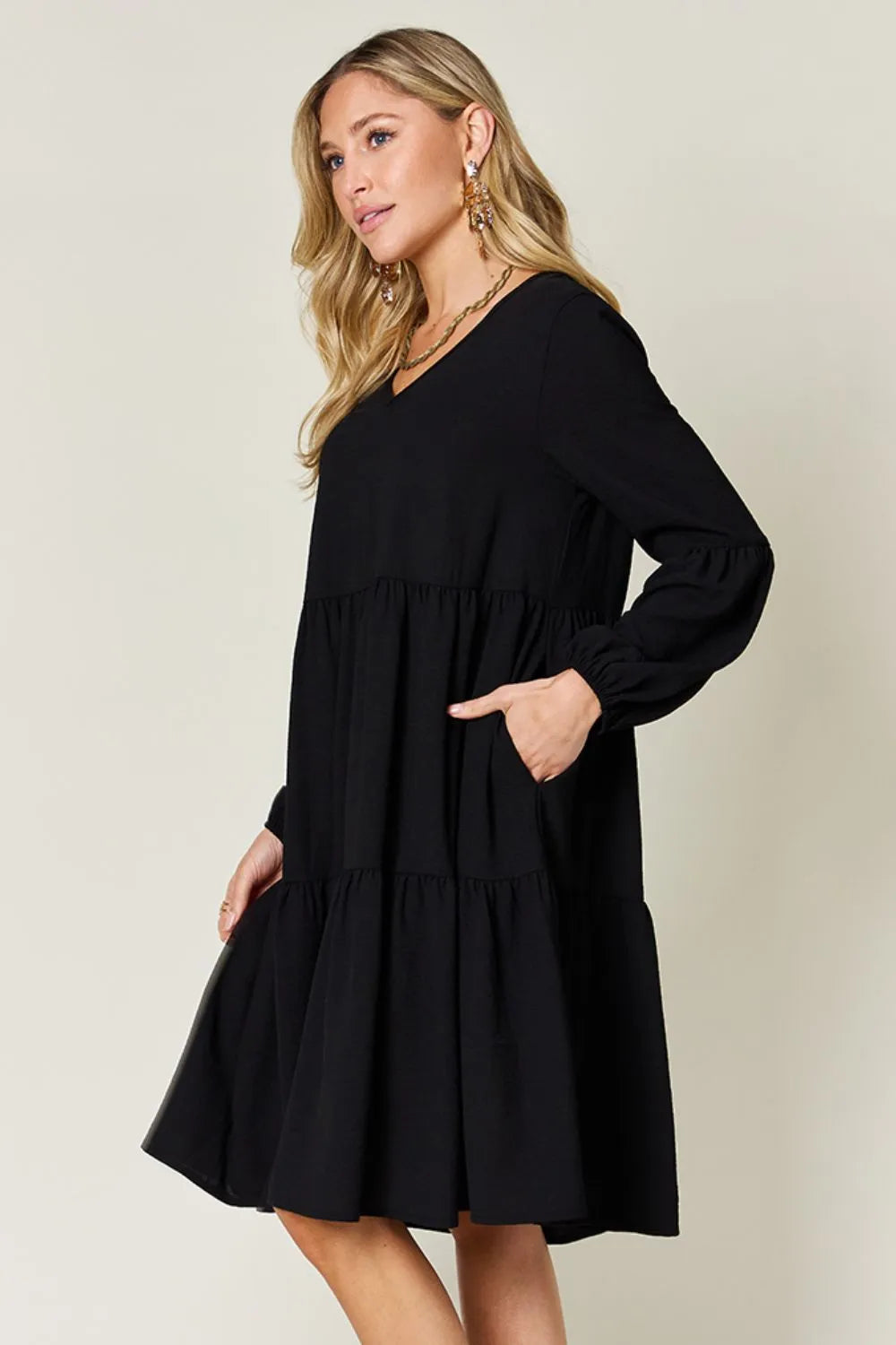 Light green Trendsi Double Take full-size V-neck balloon sleeve tiered dress with pockets, stylish and comfortable for casual wear.