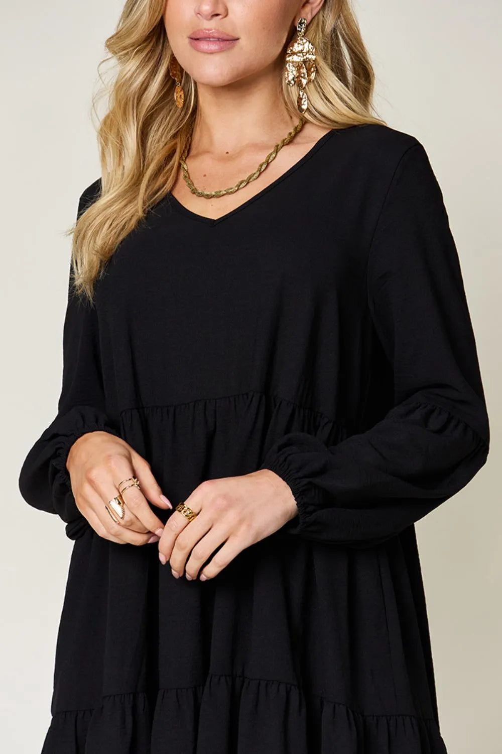 Light green Trendsi double take full-size V-neck balloon sleeve tiered dress with pockets, showcasing its flowing fabric and stylish design.