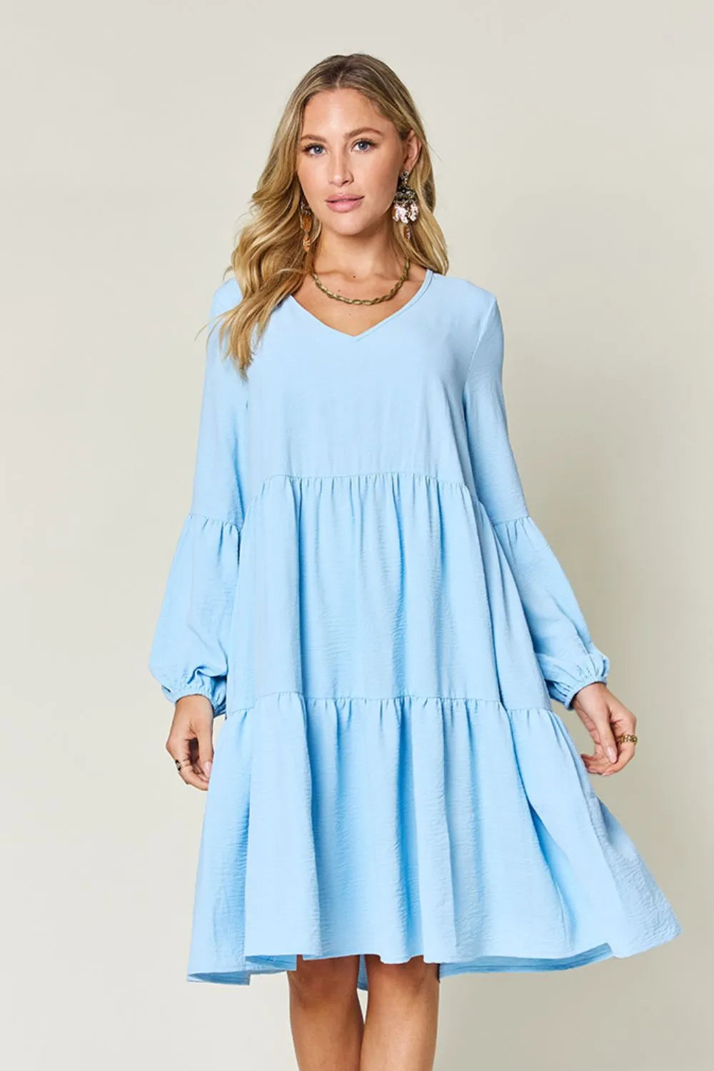 Light green Trendsi Double Take V-neck balloon sleeve tiered dress with pockets, full size, stylish and comfortable for casual wear.