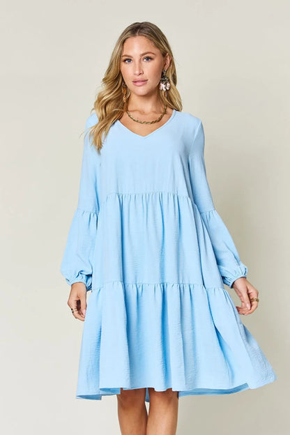 Light green Trendsi Double Take V-neck balloon sleeve tiered dress with pockets, full size, stylish and comfortable for casual wear.