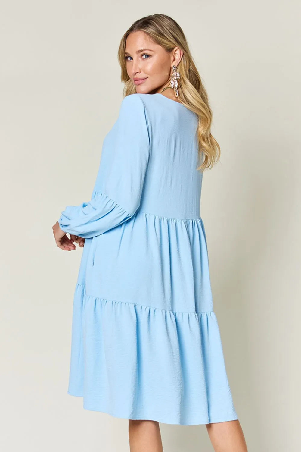 Light green Trendsi Double Take full-size V-neck balloon sleeve tiered dress with pockets, stylish and comfortable for casual wear.
