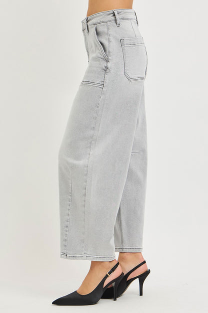 Light grey Risen slouchy cropped barrel jeans with relaxed fit and distressed details, styled with casual top and sneakers.