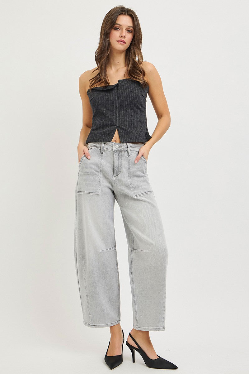 Light grey RISEN slouchy cropped barrel jeans by Trendsi with relaxed fit and distressed details, displayed hanging on a white background.