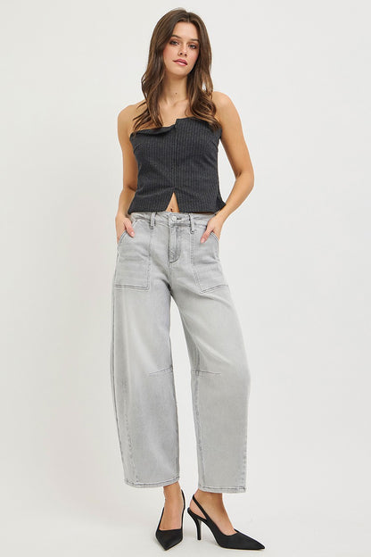 Light grey RISEN slouchy cropped barrel jeans by Trendsi with relaxed fit and distressed details, displayed hanging on a white background.